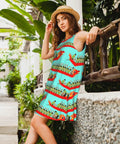 Woman in Summer Sleeveless Round Neck Dress For Women With Pockets, Lightweight 95 Percent Polyester 5 Percent Spandex Blend, Wrinkle Resistant, Knee Length Casual Day Dress With Twin Side Pockets, standing against a wooden railing in a garden setting.