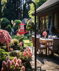 Heavy Duty 48 Inch Shepherd Hook Garden Pole For Outdoor Use That Holds Bird Feeders Planters Lanterns Solar Lights Wind Chimes Birdbaths And Yard Decor With A Five Prongs Base One Pack Easy Assembly Weather Resistant displayed in garden setting with flowers and bird feeder.