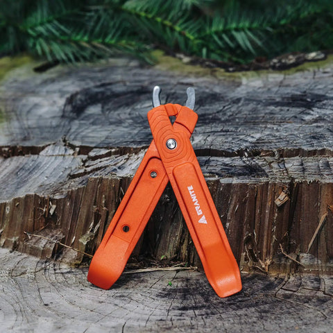 Orange Bike Tire Levers With Chain Master Link Pliers Kit For Mountain Road BMX Bikes, 2 In 1 Quick Link Remover on wood background