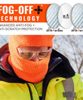 Sixteen Safety Glasses With Integrated Side Shields And Slick Anti Fog Lens That Handles Every Blue Collar Grind Features Ansi Certified Impact Protection And Includes A Microfiber Wipe For Keeping Your Eyewear Spotless After Long Shift Days worn by a worker in an orange beanie and high visibility jacket.