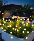 Four Pack Solar Garden Path Lights With 8 LED Firefly Glow waterproof outdoor decor lighting a nighttime patio