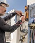 Technician using Heavy Duty Multimeter Magnet Hanging Kit with hook and clip for hands free meters on HVAC unit