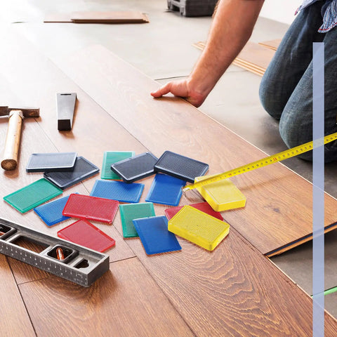 Top Notch Plastic Leveling Shims 300 Pack No Sweat Setup For Tile Floors And Cabinet Adjustment Multi Thickness Wedges in use.