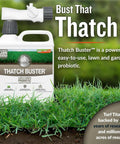 Thatch Buster Lawn and Garden Probiotic bottle with hose sprayer on lush grass background
