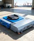 Heavy Duty Electric Transfer Cart Works Like A Charm As A Trackless Loading Platform Featuring An Industrial Rotating Turntable And Remote Control Steering For No Sweat Shop And Warehouse Moves, blue and gray design.