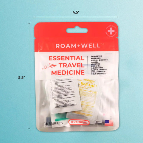 Roam+Well Essential Travel Medicine Kit front view; red/white pouch with 18 tablets, TSA-approved, Business