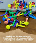 Assorted Color Round Head Craft Brads 200 Pack Top Tier Plated Metal Fasteners For Scrapbooking scattered on a wooden desk.