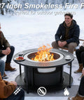 37 Inch Smokeless Fire Pit Tabletop For Outdoor Patio with people seated around in a snowy setting