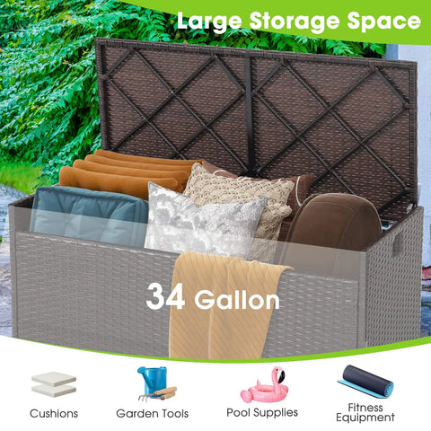 Outdoor 34 Gallon Storage Bench With Seat Cushion And Waterproof Liner, Wicker Brown Deck Box With Side Handles, Weatherproof Patio Storage filled with cushions and supplies.