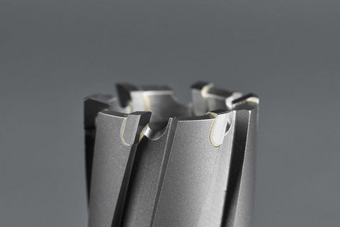 Carbide annular cutters set with Weldon shank; close-up of cutting teeth