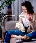 Woman using All-In-One Magnifying Lamp That Slaps With 600 Lumens Daylight LEDs, 6000K Daylight, CRI 95+, 1.75X Semi-Rimless Lens, White