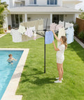 Person using Heavy Duty Outdoor Umbrella Drying Rack With 360 Degree Rotating Drying Arms Height Adjustable Clothesline by pool.