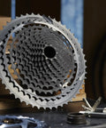 Helix Plus 12 Speed Cassette 9 To 50 Tooth For SRAM Shimano And TRP Drivetrains A Two Piece Design With Replaceable Aluminum Cogs Lightweight Tough Upgrade For Mountain Bikes, gray 12-speed cassette shown front view
