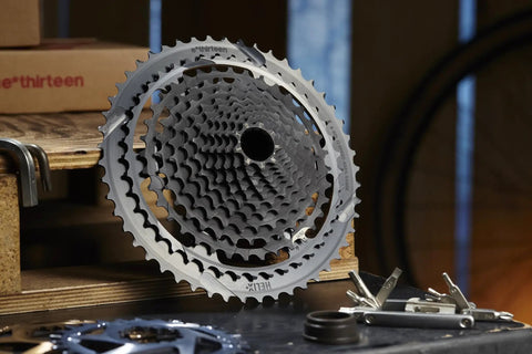 Helix Plus 12 Speed Cassette 9 To 50 Tooth For SRAM Shimano And TRP Drivetrains A Two Piece Design With Replaceable Aluminum Cogs Lightweight Tough Upgrade For Mountain Bikes, gray 12-speed cassette shown front view