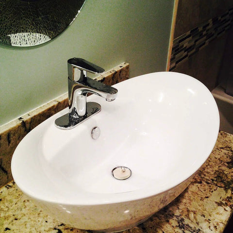 Durable Rubber Drain Stopper With Hanging Ring And 30 Centimeter Chain For Sink Bathtub And Bathroom Fits A Wide Range Of Drain Openings From One And One Eighth Inch To Two Inch No Sweat Plug And Seal For Daily Use shown in a modern bathroom sink.