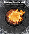 Top view of 47 Inch Round Fire Pit With Two Grills, Lid And Tabletop, 3 In 1 Outdoor Fire Pit showing flames and fire bowl