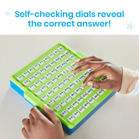 Hands using Division Practice Board With Self-Checking Dials For Kids, Game-Like Math Facts Games, Elementary Manipulatives.