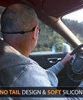 Driver wearing glasses with Glasses Strap Holder No Tail With Length Adjusters for wide and narrow temples, in a car.