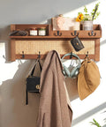 Wall Mount Coat Rack With Hooks And Shelf Made From Natural Pine And Woven Rattan A Boho Chic Entryway Organizer For Hanging Coats Keys Hangers This Space Saving Durable Wooden Holder For Hallway Bedroom And Office The Rattan Model holding coats and keys.