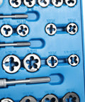 110 Piece Metric And SAE Tap And Die Set For Metalworking with engraved size markings on blue tray with assorted dies visible