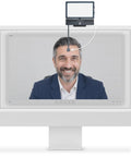 Total Game Changer 4K Eye Contact Webcam Featuring Retractable Arm and Integrated Glow Panel above a monitor during a video call.