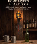 Medieval LED Torch Wall Sconce Flickering Flame Castle Light (Red) mounted on rustic wood wall, with metal mugs and liquor bottles.