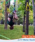 Child swinging upside down on Two In One Ninja Warrior Obstacle Course With Zip Line For Kids And Adults Transformable Backyard Slackline Kit