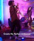 Group of friends dancing at a party with colorful lights and decorations creating a lively atmosphere in a living room.