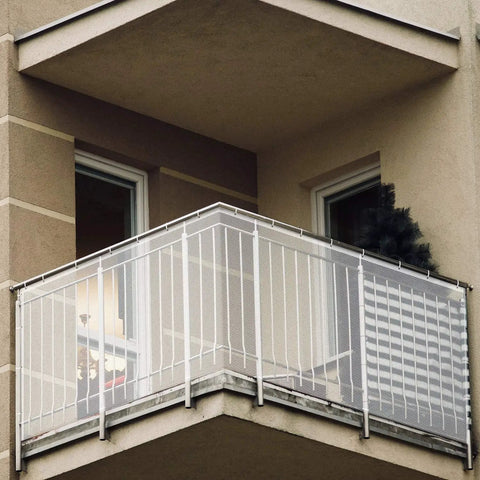 Kid Safe Banister Guard Net For Baby And Pets 15ft Long 3ft High Rail Balcony Stair Mesh installed on outdoor balcony railing.