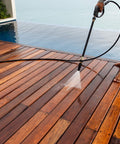 Person using Marine Penetrating Wood Sealer And Waterproofer With Stain For High Moisture Areas Water Based Ultra Low VOC Formula on deck