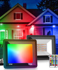 Outdoor Plug In Flood Light 50W Dusk To Dawn With IP66 Waterproof 2200lm Daylight White 6000K UL Listed Yard Garden Playground Lighting 2 Pack For Backyards And More displaying colorful illumination on house facade