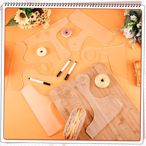 Six Piece Acrylic Router Template Set For Charcuterie Boards And Cutting Boards with three pens displayed on an orange surface