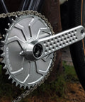 Close-up of a silver Road Bike Crank Set With 3 Bolt Direct Mount, 160Mm/165Mm/170Mm Crank Arms, on a bicycle.