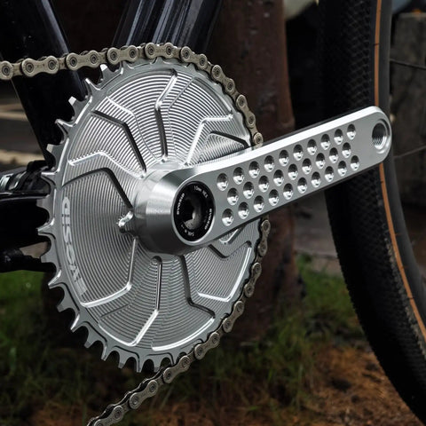 Close-up of a silver Road Bike Crank Set With 3 Bolt Direct Mount, 160Mm/165Mm/170Mm Crank Arms, on a bicycle.