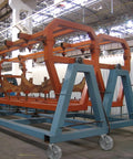 Kingpinless Casters Badass Heavy Duty Workhorse Built Different Deliver Two Thousand Five Hundred Pounds Per Wheel zero play handling precision rollers on industrial platform frame.