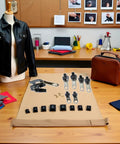 Universal Zipper Repair Kit 6 Pack With Replacement Sliders And Seam Ripper displayed on a table with tools and fabrics