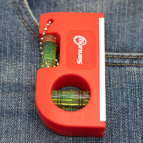 Two Piece Mini Magnetic Pocket Spirit Levels With Keychain And Storage Bag placed on denim fabric