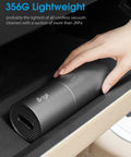 Slick Cordless Mini Handheld Vacuum With Killer Two In One Suction And Air Blaster Mode For Quick Car Detailing Keyboard Cleaning And No Sweat Dust Removal on a surface, showing the lightweight design.