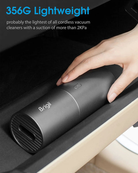 Slick Cordless Mini Handheld Vacuum With Killer Two In One Suction And Air Blaster Mode For Quick Car Detailing Keyboard Cleaning And No Sweat Dust Removal on a surface, showing the lightweight design.
