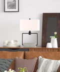 22-Inch Modern One-Light Table Lamp With White Rectangle Fabric Shade In Concrete And Blackened Bronze Finish on shelf