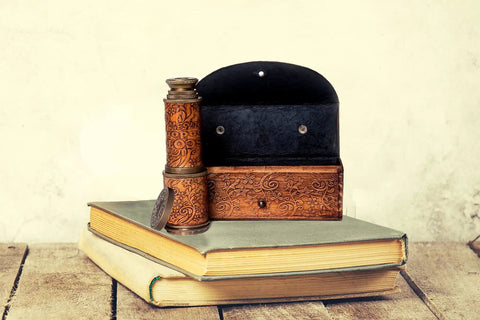 Old School Bronze Spyglass With Leather Case Seventeen Point Five Inch Brass Telescope, shown on books with case
