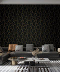 Black And Gold Peel And Stick Wallpaper With Modern Geometric Design in living room setting, covering wall behind sofa.