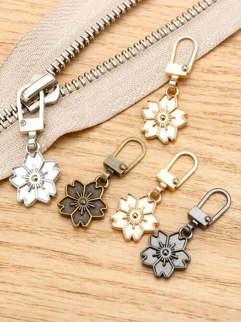 Five floral-themed zipper pulls from Zipper Pull Replacement Kit With Detachable Tabs, 5 Pcs Zipper Sliders