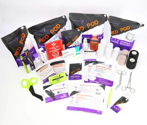 Lightning X mid-sized EMT first responder kit contents laid out; fluorescent yellow color and 200+ BLS supplies.