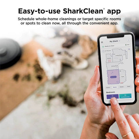Person using SharkClean app with AI Ultra Robot Vacuum for home mapping, showing room layout and cleaning zones on smartphone.