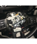 Steering Wheel Remover Kit With SAE And Metric Bolts for 4 Inch Hubs and Late Model Puller Legs in use on car steering wheel