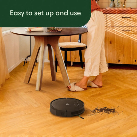 Roomba Vac Robot Vacuum With Power Suction, 3-Stage Cleaning for Carpet and Hard Floors, with person standing nearby.
