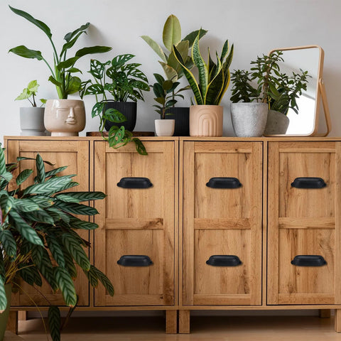 Wooden cabinet with Cast Iron Bin Pulls Set Of 10 3.5 Inch Drawer Pulls Vintage Black Cabinet Handles, potted plants on top.