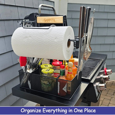 Grill Caddy For Outdoor Grill And BBQ Magnetic Tool Holder With Paper Towel Arm, filled with condiments and utensils on a grill.
