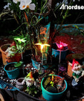 Solar Garden Lights Outdoor Set Of 6 Insect Stake Lights illuminating garden at night with colorful LED for butterflies and dragonflies.